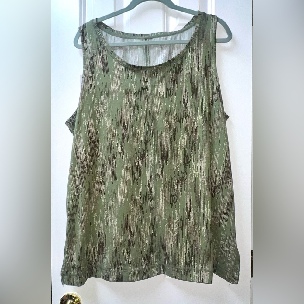 women's tank top featuring an olive green camouflage-like print.2x